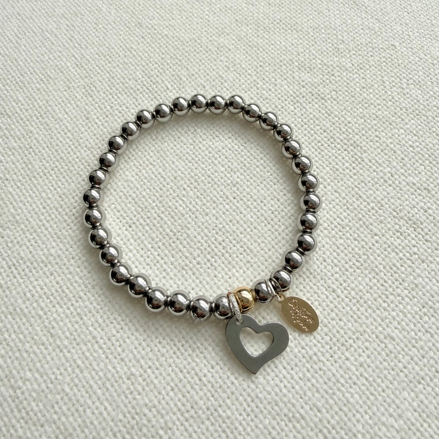 Bracelet en argent et cœur en argent