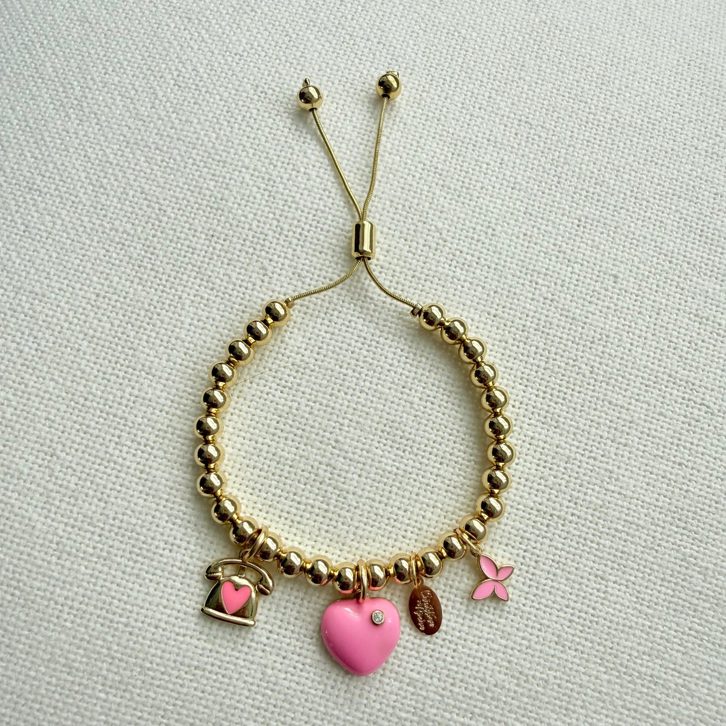 Bracelet rose à breloques