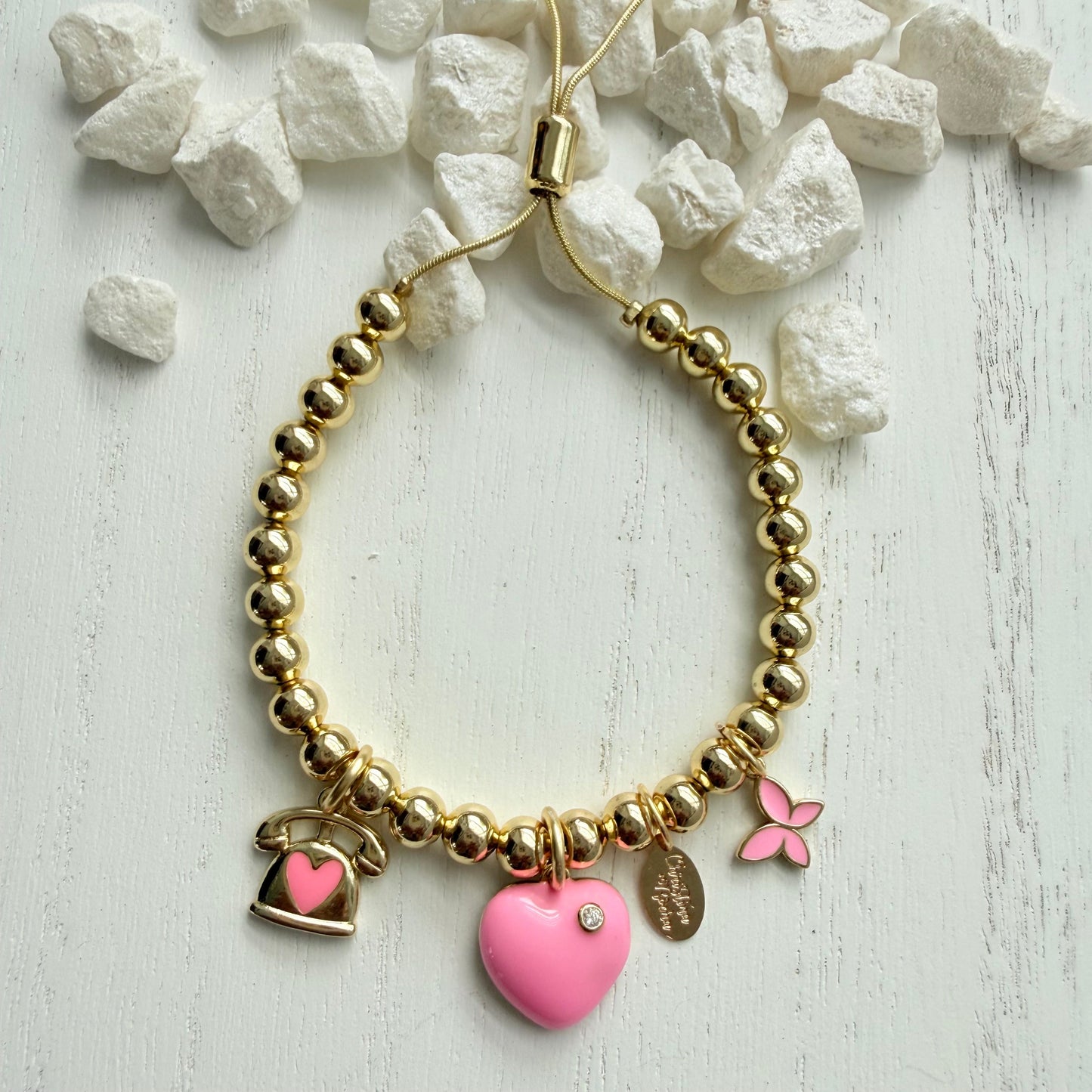 Bracelet rose à breloques